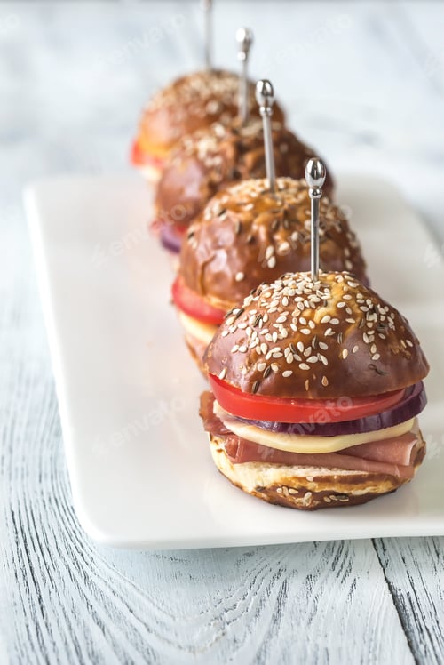 Preview: Four Mini Sandwiches Displayed On A White Plate