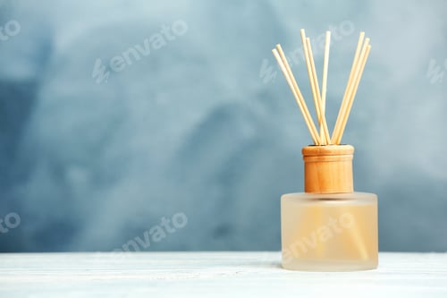 Preview: Aromatic reed freshener on table against color background