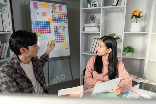 Preview: Creative team designs graphics during strategic meeting office workspace collaborative engaging