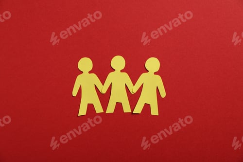 Preview: Human paper figures holding hands on red background, flat lay