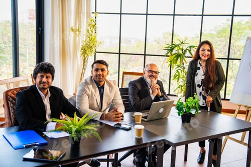 Preview: Indian Asian Team of corporate professionals working together on a business strategy in the office