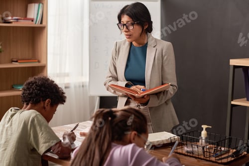 Preview: Teacher holding dictation at class