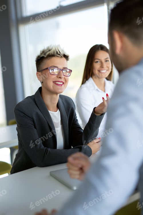 Preview: Business people having fun in modern office