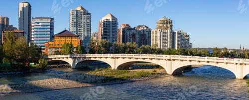 Preview: Bridge across Bow River during a vibrant summer sunrise