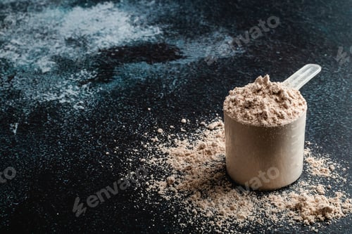 Preview: Top view whey protein scoop on dark background, copy space