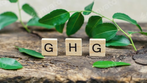 Vista previa: Abbreviation GHG on wooden cubes against the background of green leaves. Greenhouse Gas.