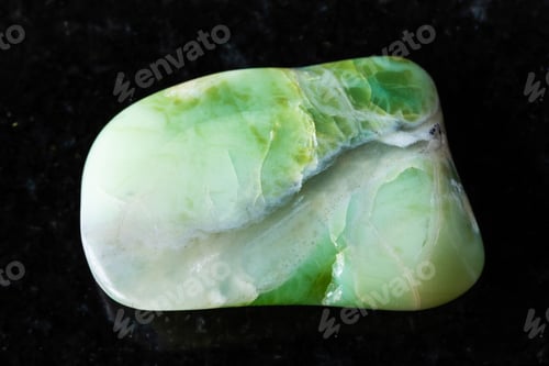 Preview: sample of tumbled green opalite mineral on black