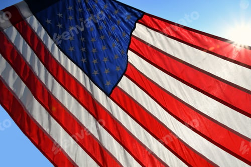 Preview: The flag of the United States of America. Old Glory. American flag with a sun flare.