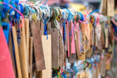 Preview: Plate wood hanging colorful thread on rail of traditional