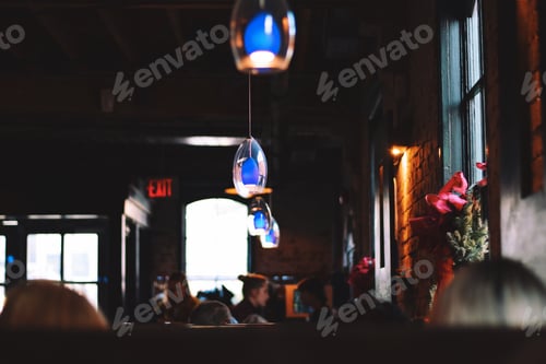 Preview: Interior of a restaurant with people sitting in booths during Christmas season