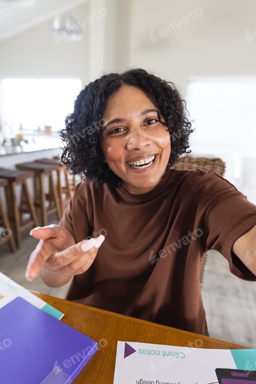 Preview: Happy biracial woman having video call