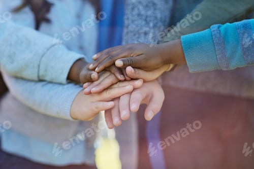Preview: Cropped shot of unrecognizable elementary school kids huddled together outside