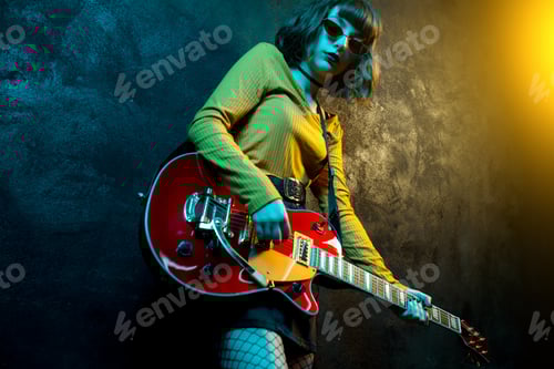 Preview: Stylish Young Woman Plays Red Electric Guitar
