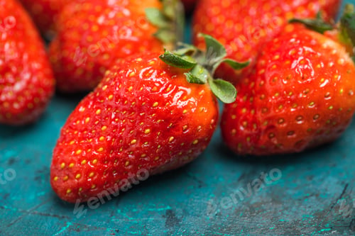 Preview: close up view of whole ripe red strawberries on tabletop