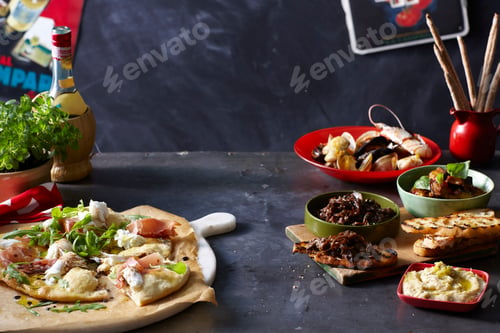 Preview: Assorted Mexican cuisine on a dark tabletop.