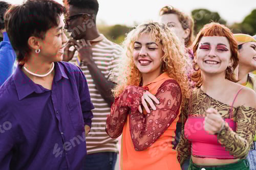 Preview: Young diverse people dancing outdoor at summer music concert