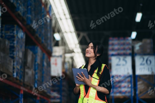 Preview: Warehouse worker working and checking the stock in the warehouse.