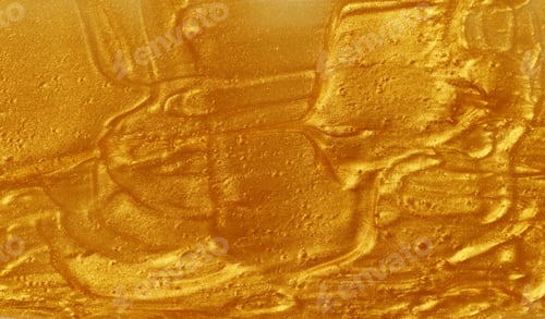 Preview: Sample of golden glitter gel with small particles, texture of highlighter cosmetics