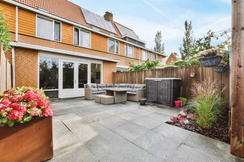 Preview: Delightful courtyard of the house with a soft sofa