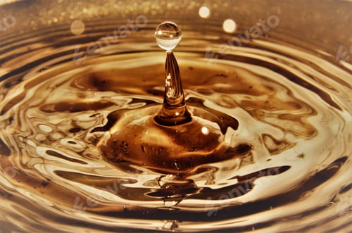 Preview: Close up of golden water droplets splashing