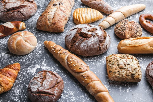 Preview: Delicious fresh bread on rustic background