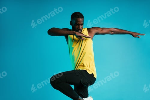 Preview: Athlete warming up his body before fitness training.