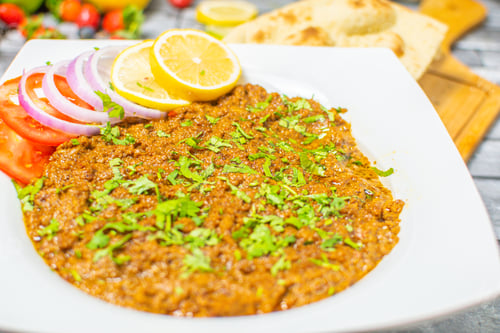 Preview: Seekh kabab Fry served in plate with Salad & Nan