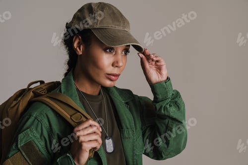 Preview: Confident african american soldier woman posing with backpack