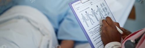 Preview: Header Image of Nurse Holding Medical Chart in Hospital Setting