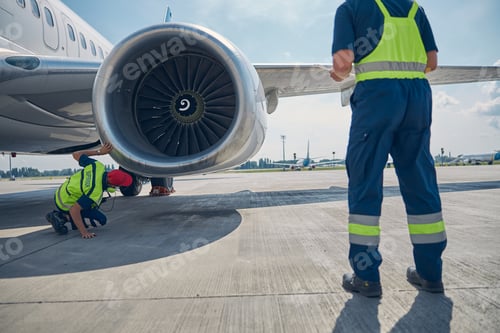 Preview: Ground crew carrying out a post-flight examination