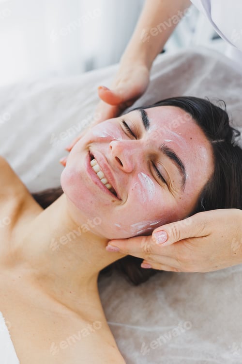 Preview: female face close-up with moisturizing skin care mask. Cosmetic female mask.