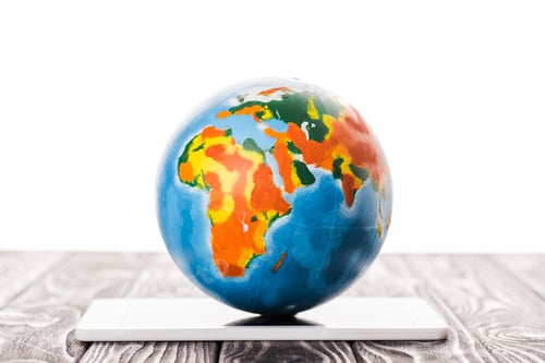Preview: colorful globe on digital tablet isolated on white, e-commerce concept