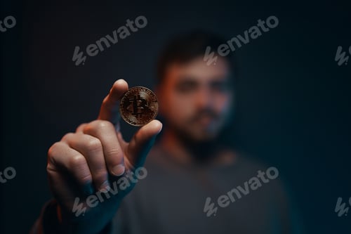 Preview: Man holding bitcoin. Financial ecosystem. The currency of the future.