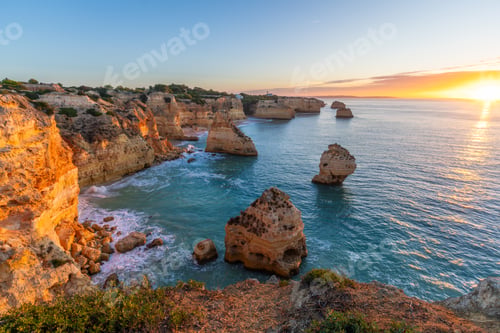 Preview: Marinha Beach, Cliffs and Atlantic Ocean at Sunrise. Portugal