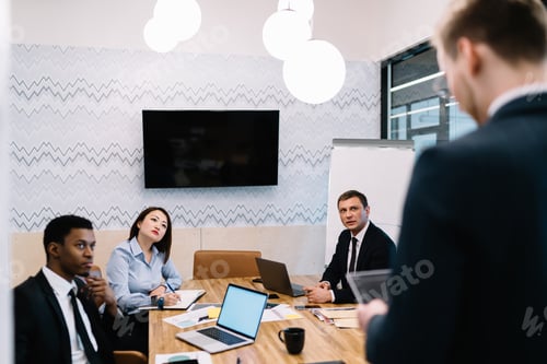 Preview: Business partners listening leader ideas at meeting