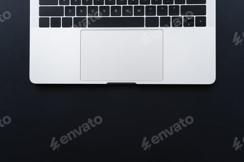 Preview: top view of laptop keyboard and touchpad on black