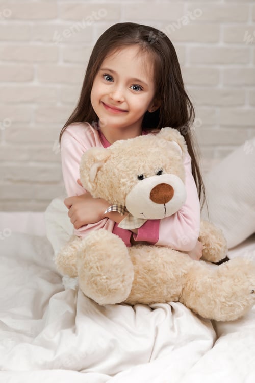 Preview: baby hugging a teddy bear
