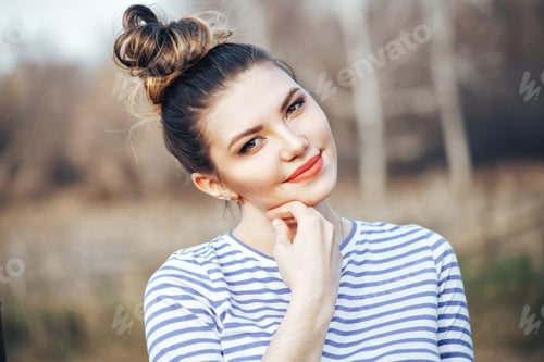 Preview: Beautiful Woman with Messy Bun and Striped Shirt