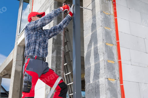 Preview: Construction Worker Uses Tools to Install House Gutters