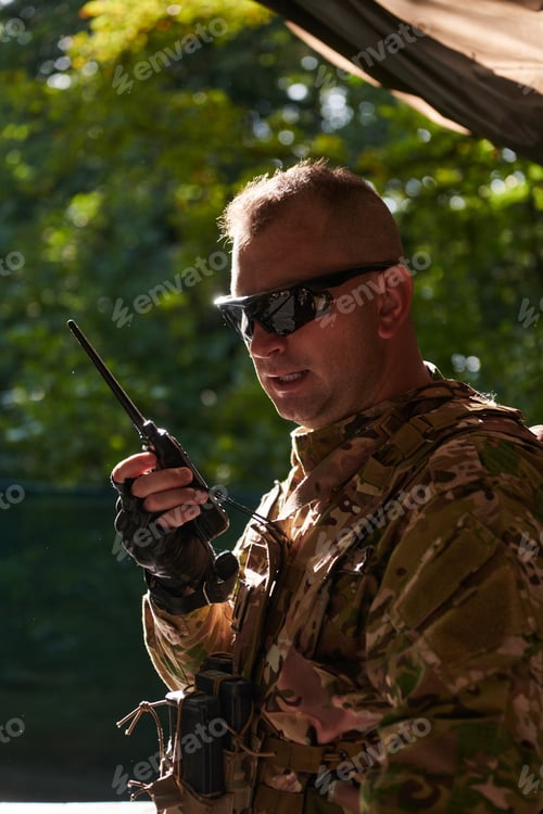 Preview: A military major employs a Motorola radio for seamless communication with his fellow soldiers during