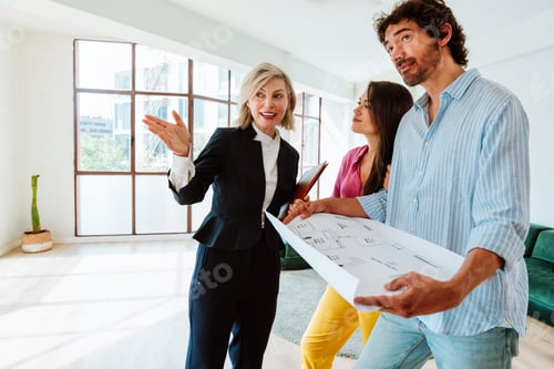 Preview: Real estate agent showing an apartment to a couple.