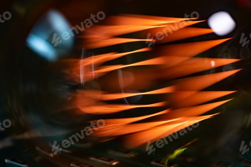 Preview: An incandescent lamp illuminates a dark room with orange light