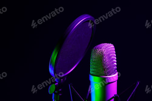 Preview: Professional microphone against black background in studio