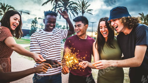 Preview: Group of friends enjoying out with sparklers
