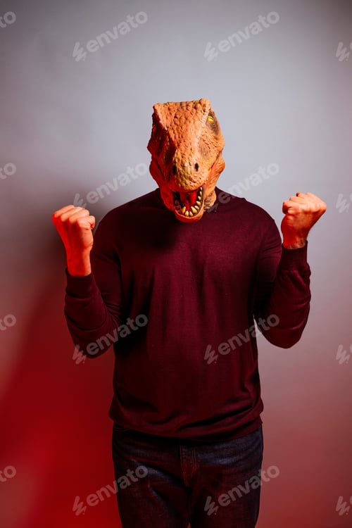 Preview: Man with lizard head in the studio.