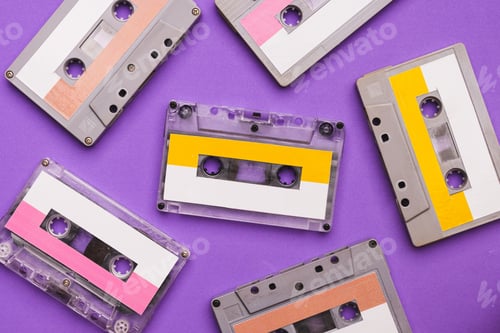 Preview: Collection of cassette tapes on purple background.