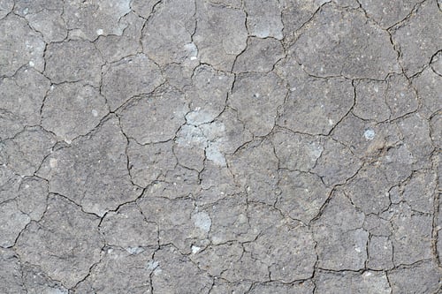 Preview: Dry cracked background of volcanic ground turned into desert. Natural abstract pattern texture