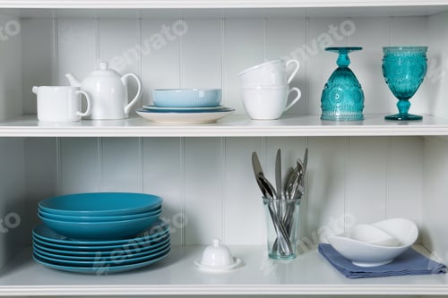 Preview: White shelving unit with set of dishware