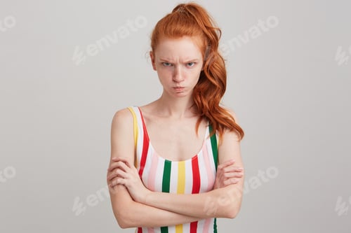 Preview: redhead young woman with freckles and ponytail wears striped top