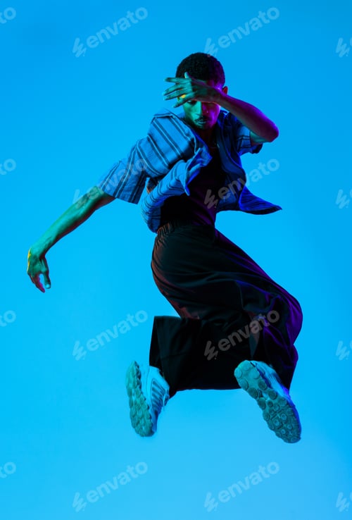 Preview: African man portrait in studio on colorful background